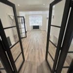 Black Soho Room Divider with Clear Glass in Situ