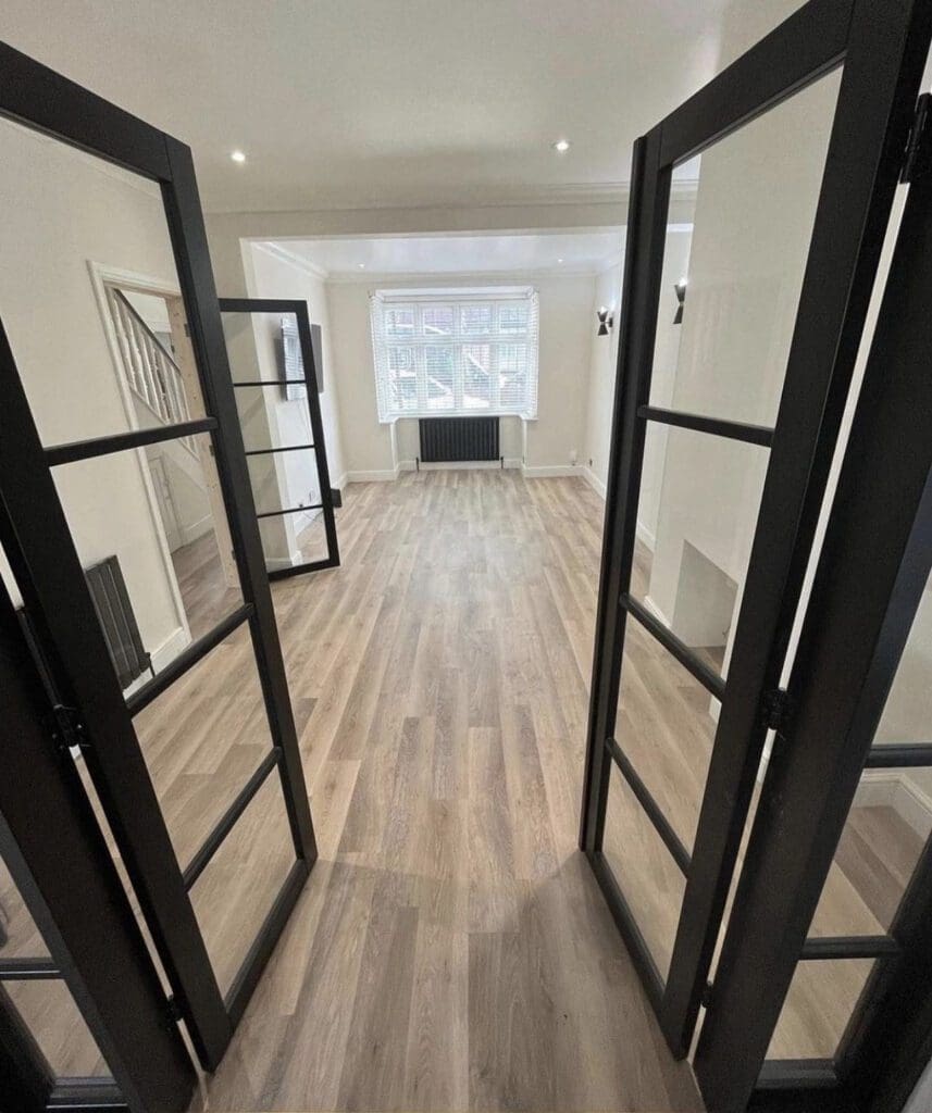 Black Soho Room Divider with Clear Glass in Situ