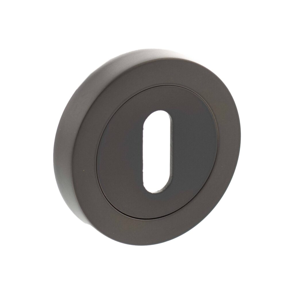 Old English key escutcheons on round rose in Urban Dark Bronze finish
