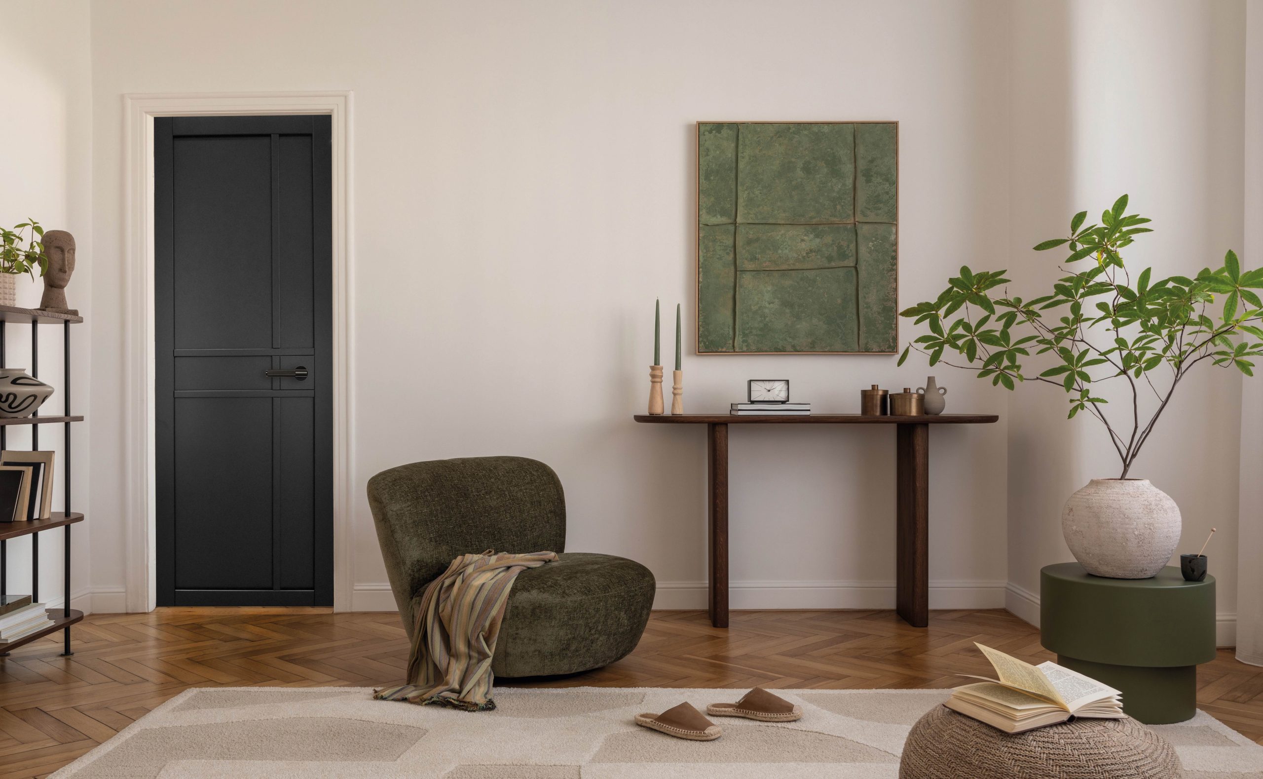 Dark panelled internal door in a warm, modern living space with wooden flooring, soft neutral walls, and natural décor elements.