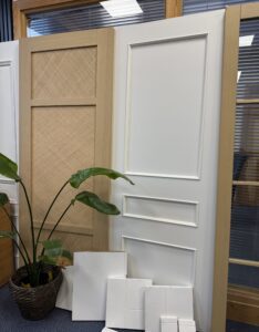 White Toledo internal door on showroom display with clean panel design